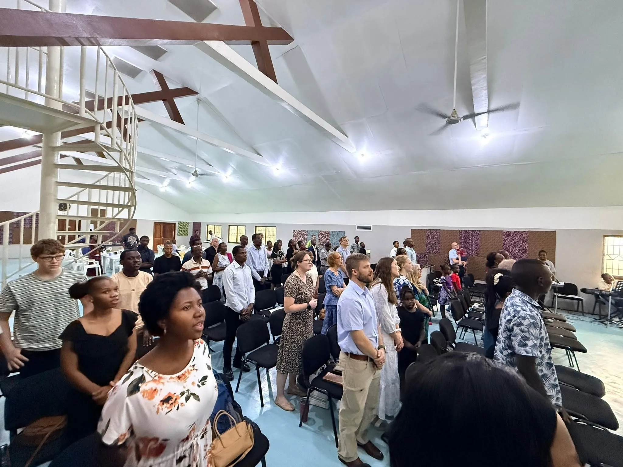 Church members from many backgrounds singing together